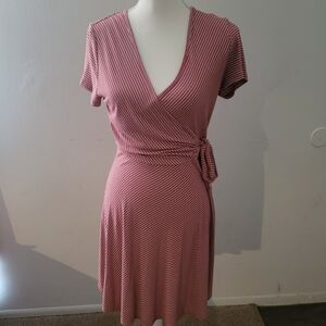 Beautiful wrap dress in a maroon color with white stripes. Perfect for any day!